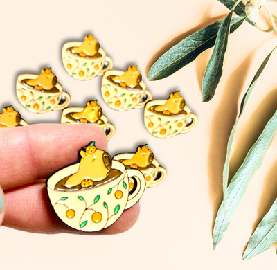 Cute Kawaii capybara in teacup enamel pin yellow green orange 