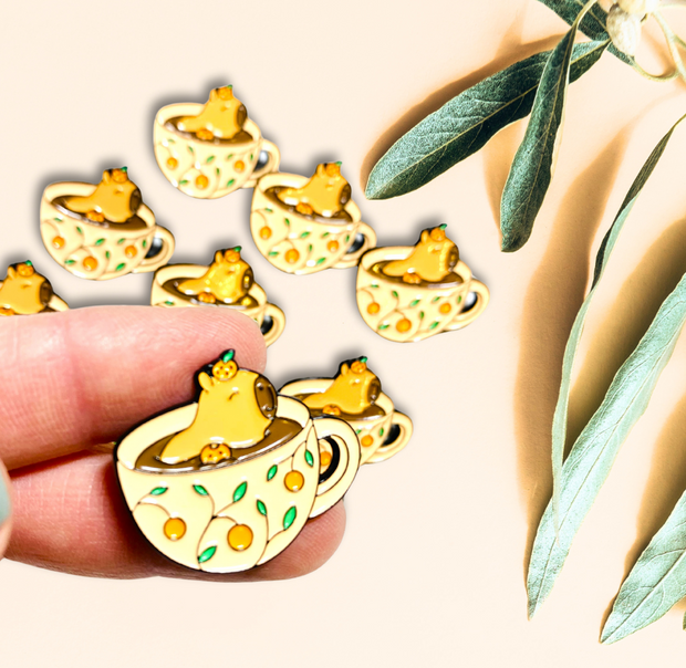 Cute Kawaii capybara in teacup enamel pin yellow green orange 