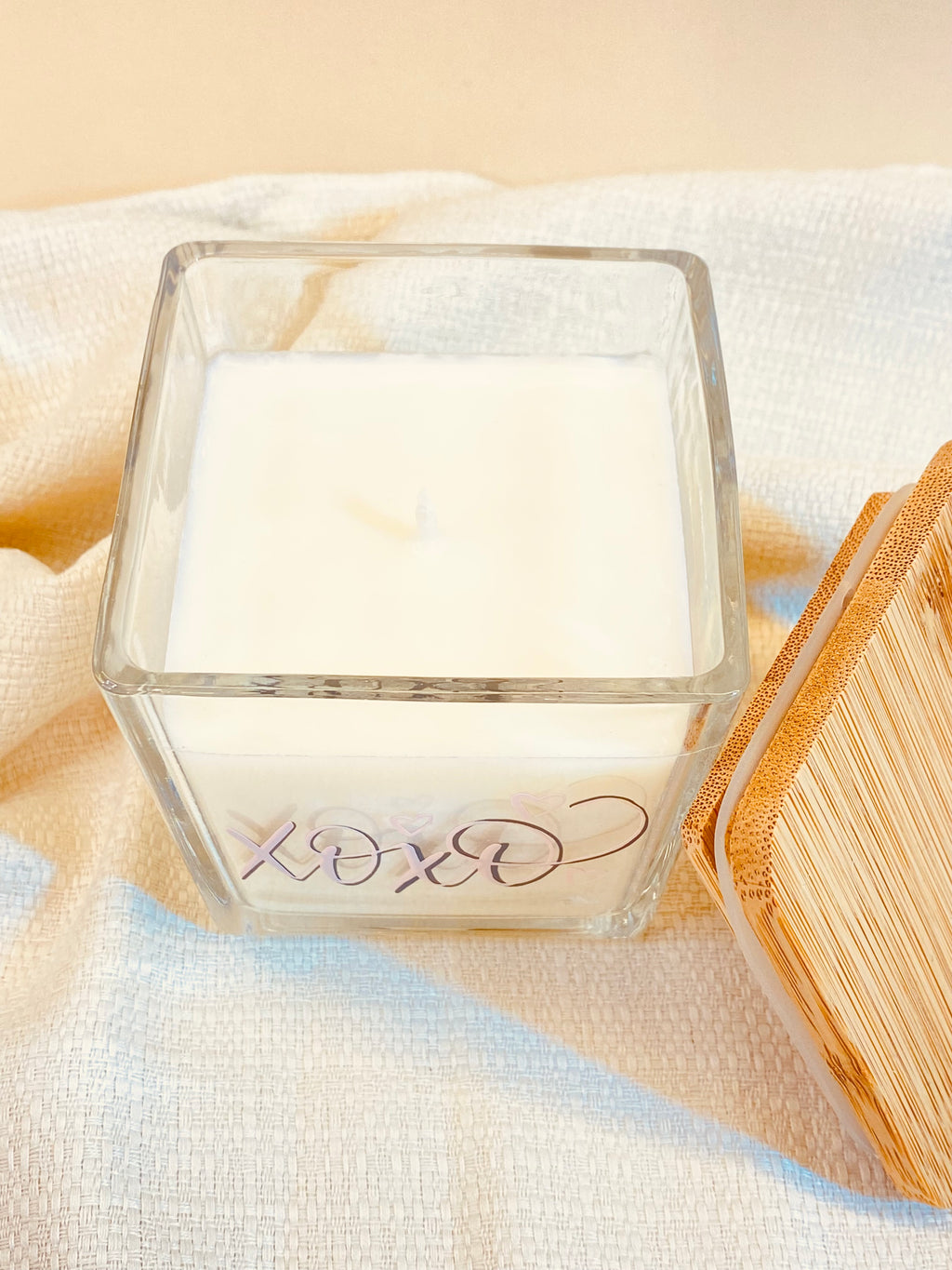 Natural Soy Wax Candle 9oz Customizable in a glass vessel with rose-toned script and wood lid.