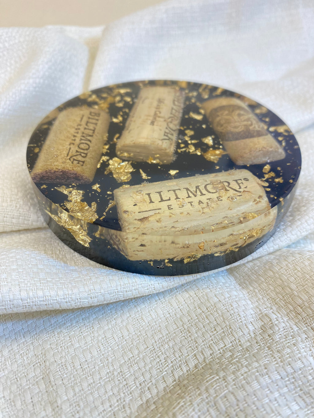 Handmade wine lover gifts Wine Cork Resin Coaster with gold leaf accents on a textured background.