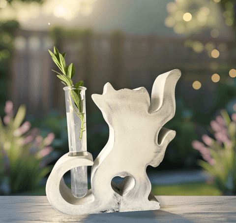 Concrete cat vase for plant propagation, featuring a transparent tube for monitoring root growth.
