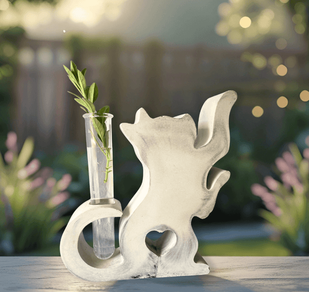 Concrete cat vase for plant propagation, featuring a transparent tube for monitoring root growth.