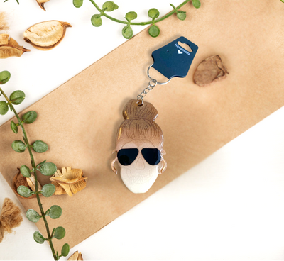 Resin girl skull keychain available in brown hair, black hair, and blonde hair