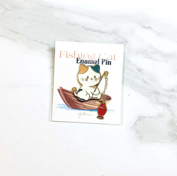 Cute Cat Fishing Enamel Pin on card, perfect accessory for cat lovers, ideal for bags and jackets.